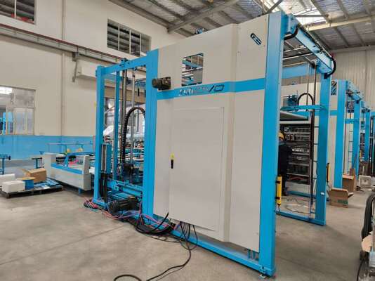 Macchina impilatrice automatica a ribaltamento che integra tavolo carta lento e componenti di sistema per la svolgitura e l'impilamento di flauto in produzione di imballaggi